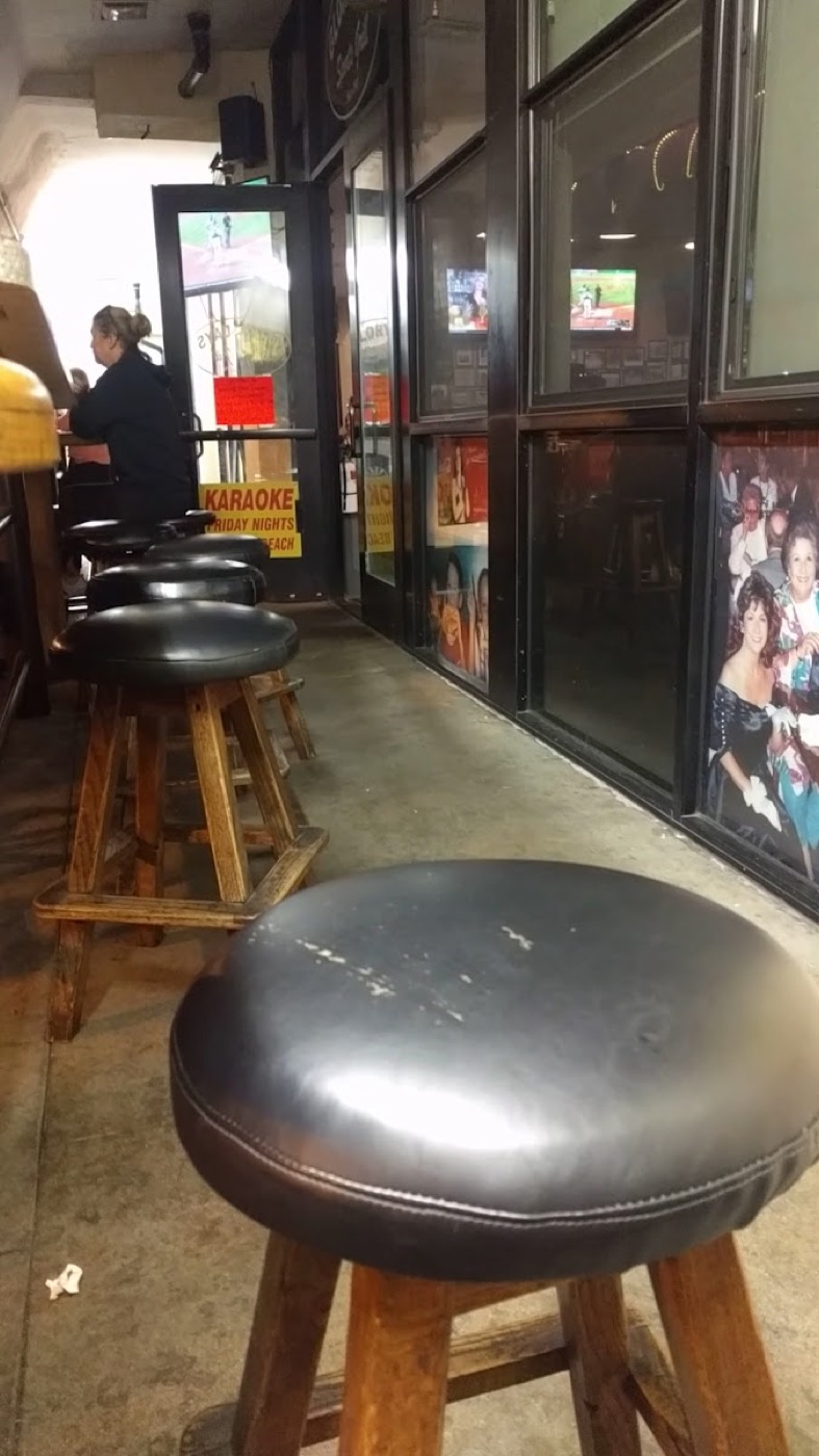Real customer photos hung on the wall at Glory Days Sports Grill, part of the restaurant's decades-old tradition